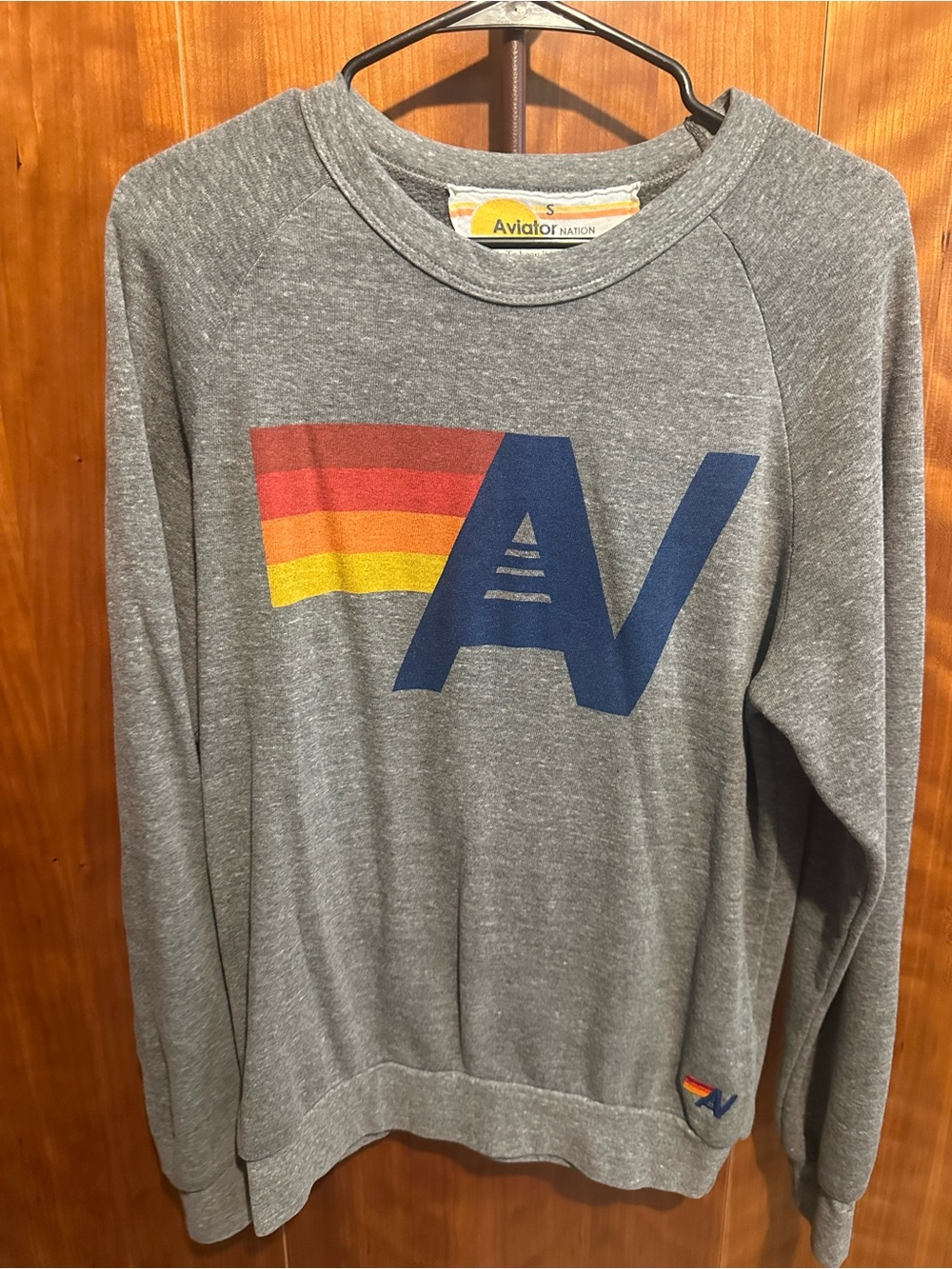 Aviator Nation Heather Gray Crewneck with Navy AV and Red-Orange-Yellow Stripe